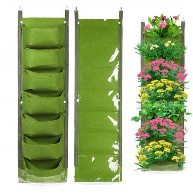 China Eco-friendly 7 Pockets Modern Green Felt Fabric Waterproof Fabric Garden Beauty Plant Pots Planting Bag Vertical Hanging Grow Bag for sale