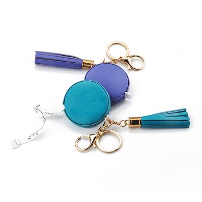 China Custom Pattern Decorated Multi-Function Soft Mini Round Metal Leather Tassel Key Chain Luxury PU Tape Measure Sliver for sale