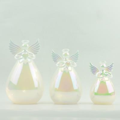 China Blown Mouth Glass Iridescent Color Glass Angel With Led Christmas Light Decoration for sale