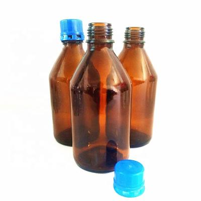 China Amber Brown Glass Chemical Reagent Bottle With Blue Cap 500ml for sale