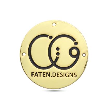 China Sustainable Customized Metallic Labels Handbag Engraved Round Gold Metal Logo Tag With Hole for sale