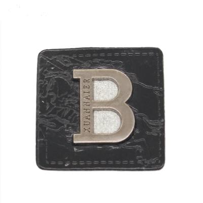 China Viable Custom Engraved Label Brand Letter Metal Plate Logo For Swimsuit Shoes for sale