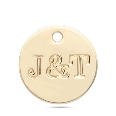 China Customized high quality round letter zinc alloy metal engraved logo pendant charms for bag for sale