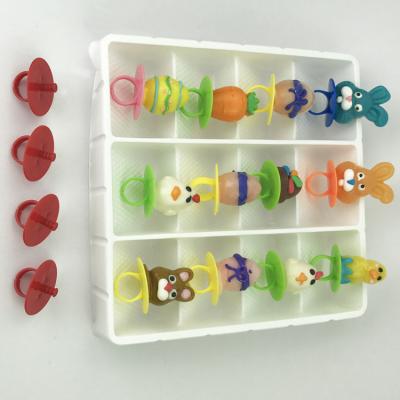 China Plastic Food Grade Ring Lollipop Nipple Candy Baby Pacifiers Made In Quanzhou for sale