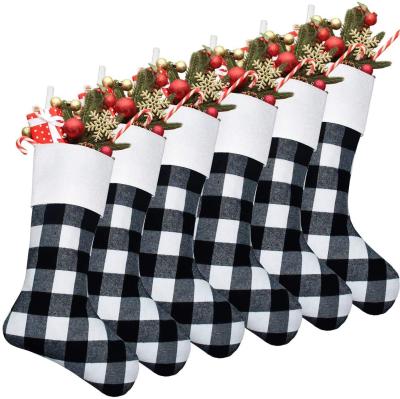 China Black and White Christamas Home Decoration Buffalo Plaid Christmas Stocking Gift Bags for Christmas Decorations for sale