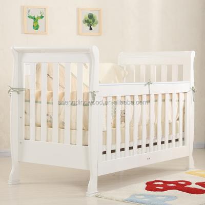 China New Zealand Pine Solid Wood Solid Wood Baby Crib / Baby Hutch With Storage Drawer for sale