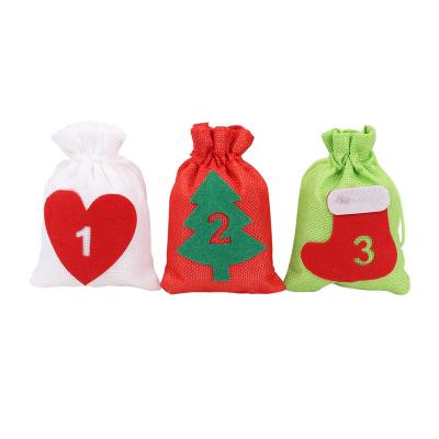 China 24PCS COTTON AND JUTE Christmas Advent Calendar Cotton Jute Fabric Sack Set Decorative Christmas Candy Gift Bag for sale