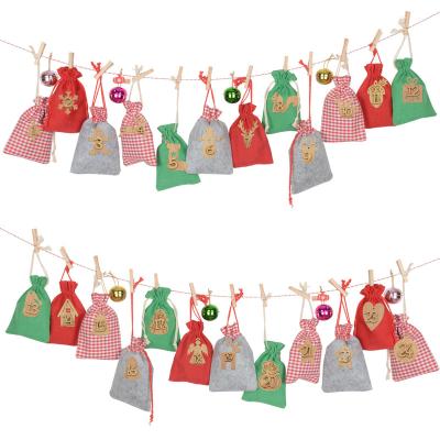 China felt & 1-24 PCS Cotton Fabric Yiwu Christmas Date Felt Fabric DIY Candy Storage Calendar Bags For Christmas Home Decorations for sale