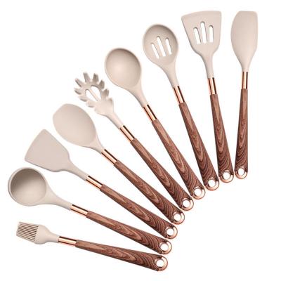 China Sustainable Wood Grain Coating 9 Pieces Nonstick Silicone Cookware Cookware Kitchen Utensils Set with Rose Gold Accessories for sale