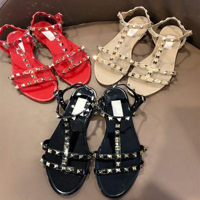 China CUSHIONING New Skyline Fashion Roman Style Rivet Open Toe PVC Jelly Flat Sandals Non-slip Women's Sandals for sale