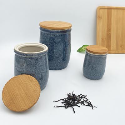 China Customized Viable Airtight Design Cylinder Tea Canister Ceramic Jars For Kitchen Countertop With Bamboo Lid for sale