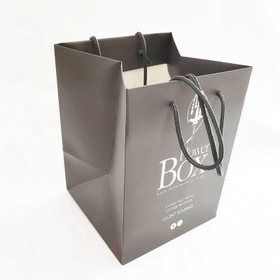 China Qingdao Unicorn Logo Disposable Kraft Paper Gift Bags In Square Shape for sale