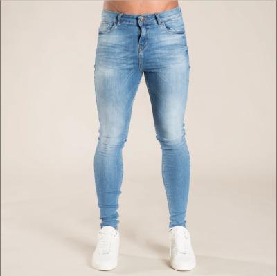 China New station comfortable European men's slim jeans ripped European and American hot men's skinny pants men's pants for sale