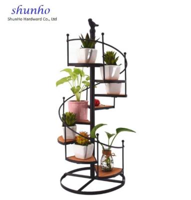 China Retro Decoration Iron Candlestick Refreshment Sustainable European Rotary Rack Staircase Office Decoration for sale