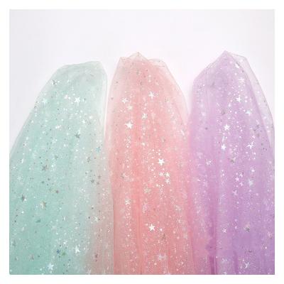 China Star Pentagon Shrink-Resistant Laser Foil Printing Yarn Fabric Tulle Fabric Colors For Embroidery Flower Dress Fabric for sale