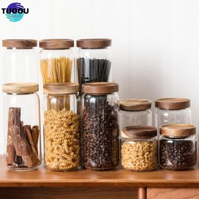 China Heatable Heat resistant clear round glassware airtight sealed custom size kitchen food large containers wood lid glass jar storage for sale