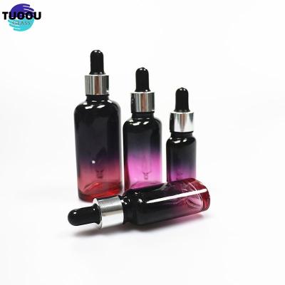 China Essential oil container Wholesale Hot sale Pink Perfume Oil Bottles Square Liquor Glass Bottle 50ml en venta