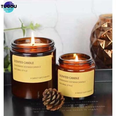 China Home Decoration Wholesale of amber glass candle cans with lids for sale