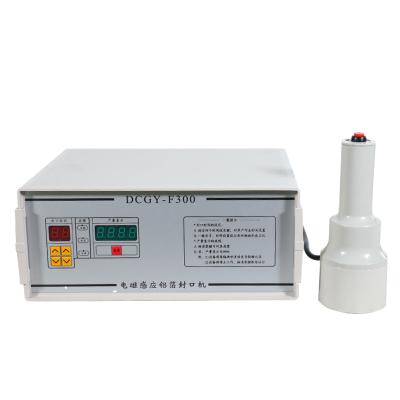 China High Efficiency Hand Held Manual Heat Jars Induction Sealing Machine For Bottles for sale