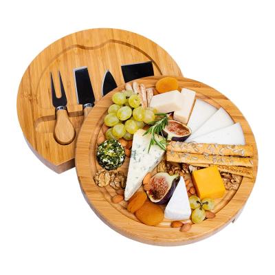 China Sustainable Bamboo Cheese Board And Knife Set 10 Inch Round Charcuterie Board Serving Tray Platter Wood Cheese Board Set for sale