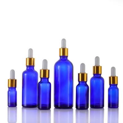 China Recyclable UV Protection Recycled Glass Dropper Bottle Cosmetic Packaging With Blue Glass for sale