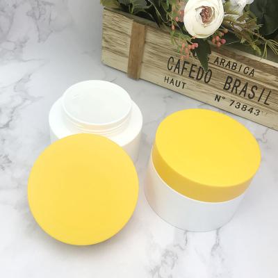 China Luxury Round Plastic Cosmetic Jars Skin Care Container 100g Body Cream Jar for sale