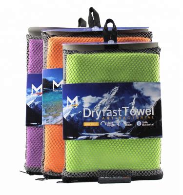 China Compressed Custom Logo Promotion Microfiber Outdoor Sports Towel With New Fashion Design Mesh Bag for sale