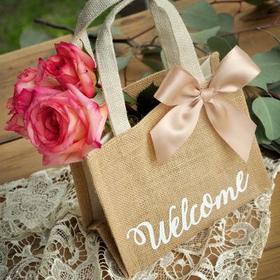 China Custom Made Eco Friendly Handled Logo Jute Shopping Bags Hotel Burlap Wedding Guest Gift Welcome Bag for sale