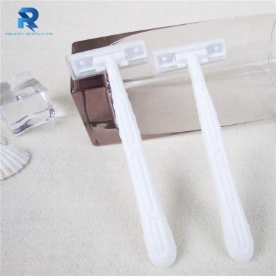 China Twin Blade Lubricating Strip Handle Plastic Hotel Bathroom Shaving Razor for sale