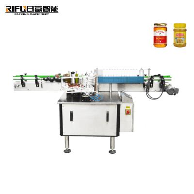 China Automatic Beverage Plastic Cold Glue Round Bottle Food Bottle Labeling Machine for sale