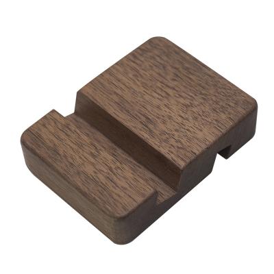 China Farmhouse creative PORTABLE beech wooden cell phone base wooden cell phone holder mobile phone stand for sale