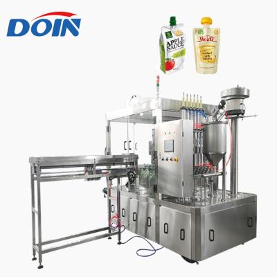 China Food Doin supply yogurt spout pouch screw packing machine factory/soy milk doypack spout pouch filling capping machine for sale