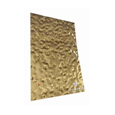 China Architecture decoration and embossed fabrication 304 0.2mm 8k water wave finish metal punched gold color water ripple stainless steel sheet for ktv decoration for sale