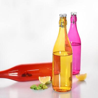 China Sustainable 1000ml Colored Glass Water Bottle With Top Clip Lid Glass Water Canister for sale