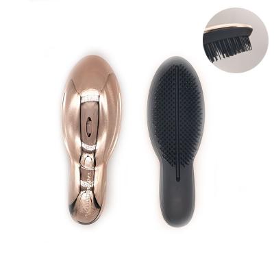 China Compact Popular Golden Detangling UV Printing Hair Brush for sale