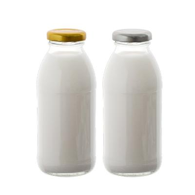 China Wholesale 300ml Food Grade Food Grade Milk Glass Bottle Metal Lid Milk Bottle Custom Heater for sale