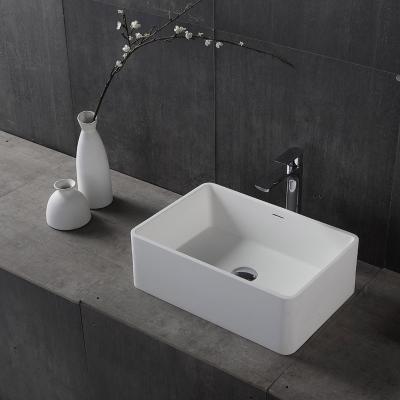 China Soft & smooth Wholesale bathroom solid surface pedestal sink black resin stone composite freestanding washbasin hand washing basin for sale