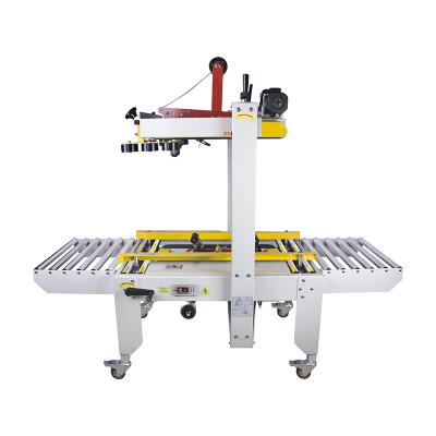 China FXJ-6050 Food Top Bottom Transmission Cardboard Tape Box Box Sealing Banding Machine for sale