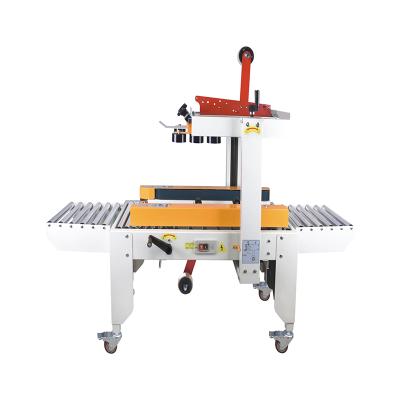 China FXJ-5050 Food Box Strip Left Right And Top Drive Random Sealing Machine For Carton Or Box for sale