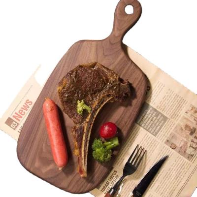 China Modern Solid Wood Steak Tray Pizza Board Bread Board Black Walnut Paintles Wood Chopper for sale