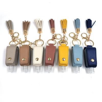 China Mini Spray Hand Sanitizer Bottle Portable Wholesale Tassel New Product Key Chain With Metal Key Ring for sale