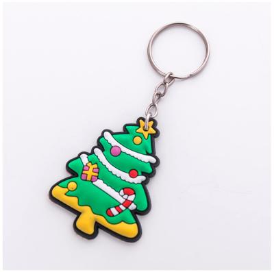 China Professional Design Cute Christmas Gift Candy Eco-friendly Rolling Xmas Tree PVC Rubber Material Keychains for sale