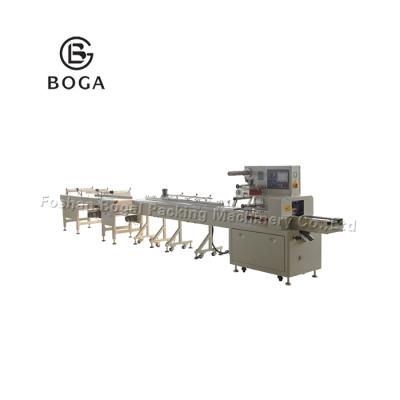 China CLOTHING factory automatic tiramisu cup cake packing machine price for sale