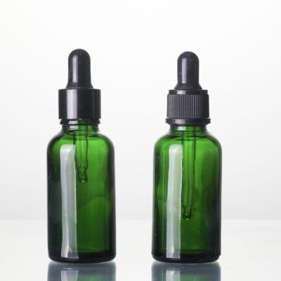 China Personal Care 15ml 20ml 30ml 50ml Green Essential Oil Glass Bottles for sale