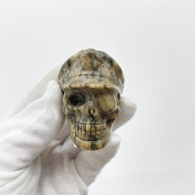 China China wholesale natural hand carved Crystal Tiger stripes stone skulls fengshui stone skull healing for decoration and gifts for sale