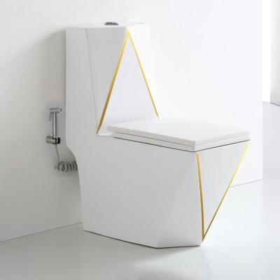 China Dual-Flush Ceramic Sanitary Ware WC Once Piece White And Gold Toilet With Integrated Sanitary Ware Toilet for sale