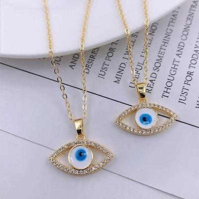 China FASHIONABLE Bohemian Brass Micro Blue Eyes Zircon Inlay Evil Eye Cavity 18K Gold Plating Style Simple Pendant Necklace Jewelry For Women for sale