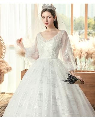 China 2021 New Style Bride Dry Cleaning Long Sleeve Floor Length Diamond Bead Plus Size Wedding Dress for sale