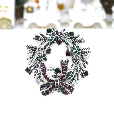 China Everyday Life Hip Hop Christmas Antique Bow Garland Flower Gemstone Rhinestone Brooch Silver Plated Pin for sale