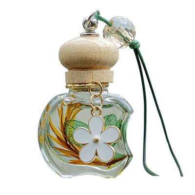 China PORTABLE Custom Car Pendant Essential Air Freshener Oil Aromatherapy Diffuser Glass Bottle Perfume Car Hanging Perfume with Wood Lid for sale